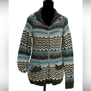 A classic from Ricki’s  long zippered sweater with collar.